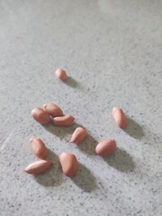Close-Up of Raw Peanuts on Granite Surface
