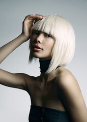 beautiful blond hair young woman with fringe and bob hairstyle