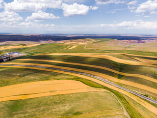 Obraz premium road, landscape, sky, field, nature, country, summer, grass, clouds, rural, countryside, way, travel, horizon, green, asphalt, hill, path, cloud, highway, land, agriculture, mountain, view, dirt