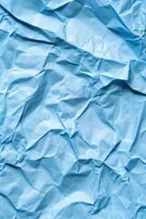 Obraz premium Crumpled blue paper texture for creative background and design projects