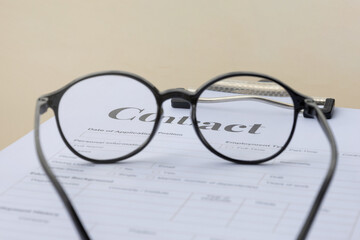 contract paper viewed from eyeglasses