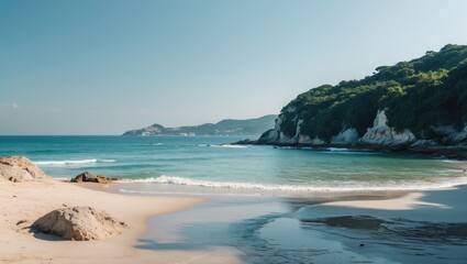 Serene Beach Landscape with Clear Blue Water and Lush Green Hills Under Sunny Sky Ideal for Relaxation and Scenic Beauty