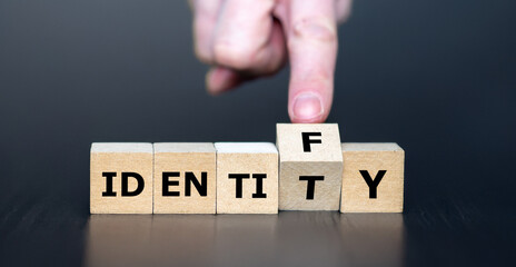 Hand turns cube and changes the word identity to identify.
