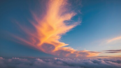 Fototapeta premium Serene Dawn Sky with Vibrant Orange and Blue Gradient Clouds Above a Soft Layer of Fog Ideal for Tranquil and Peaceful Backgrounds.
