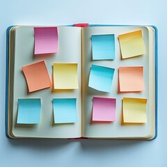 Colorful sticky notes attached to the pages of an open notebook, placed randomly, against a plain white background, ideal for reminders, organization, and planning.
