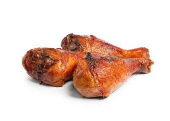 Delicious baked turkey drumsticks isolated on white