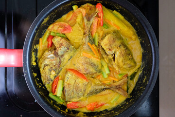 Pesmol fish or ikan pesmol with yellow curry.