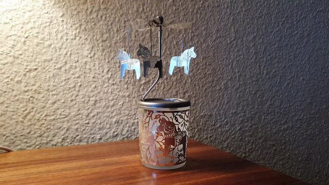 Dalecarlian horse, rotating candle holder.