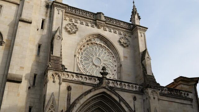 Bilbao, Spain - February 18, 2025: Tourists and citizens walking in front of the Cathedral of Santiago in Bilbao, Spain.