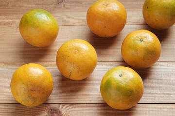 Clementine on wooden. Abstract fruit Background