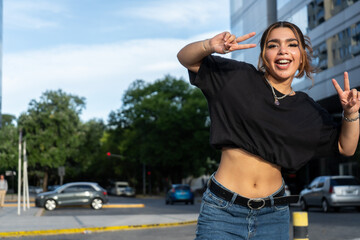 Young woman joyfully posing on city street