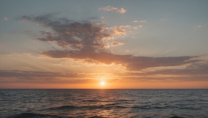 Obraz premium tranquil sunset over calm ocean with golden hues and scattered clouds in the sky reflecting warm light