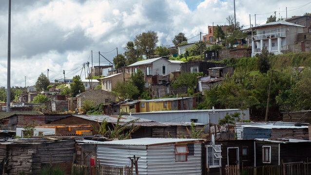 South Africa informal settlement on a hill, houses made of corrugated metal sheet and cardboard