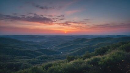 Obraz premium Sunset over rolling hills with dense forests under a colorful sky in a tranquil landscape setting.