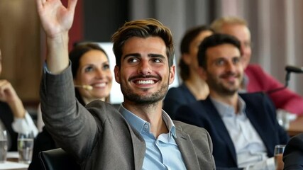 A cheerful man in a business environment smiles and raises his hand. He is eager to participate in the conversation. This video captures the excitement of learning. Generative AI