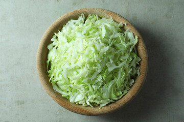 Fresh shredded cabbage on light table, top view