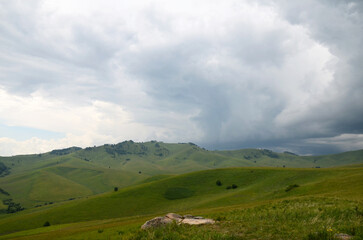 Fototapeta premium Green hills and mountains, panoramic view of mountains, before rain