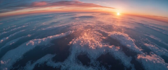 Aerial view of clouds and ocean during sunset with vibrant colors and soft cloud formations against a colorful sky.