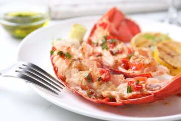 Delicious lobster tails with green onion on white table, closeup