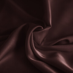 Obraz premium photo of chocolate silk fabric template of fabric roll of fabric