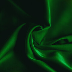 Obraz premium photo of emerald silk fabric template of fabric roll of fabric