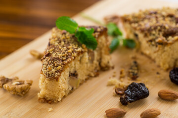 Homemade sponge cake with nuts and prunes