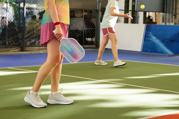women playing the popular game pickleball