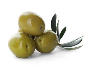 Delicious marinated green olives and leaves isolated on white