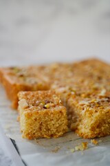 Eggless Semolina or Rava cake topped with nuts, selective focus