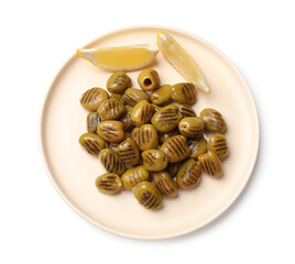 Grilled green olives and lemon wedges isolated on white, top view