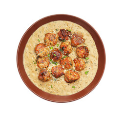 Delicious meatballs with gravy cream sauce and herbs isolated on white, top view