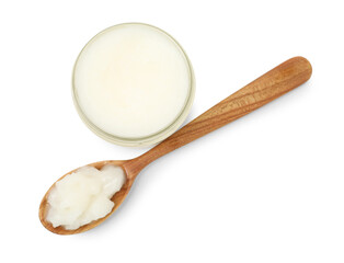 Organic coconut cooking oil in glass jar and spoon isolated on white, top view