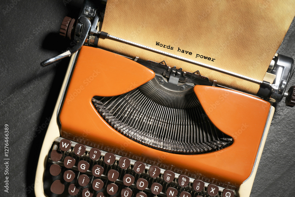 Fototapete typewriter with sheet of paper on table, top view. typed text words have power