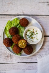 Homamade Falafel served with yogurt dip, selective focus