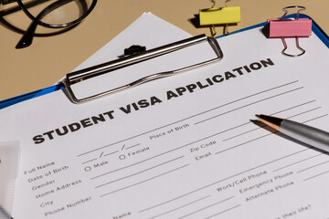 Student Visa Application Form on Clipboard