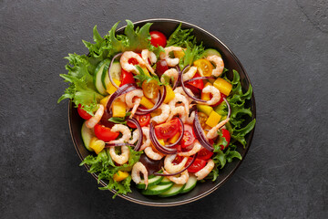 Easy  salad of fresh cucumber, tomato, sweet pepper, shrimps and onion . Healthy food. Top view