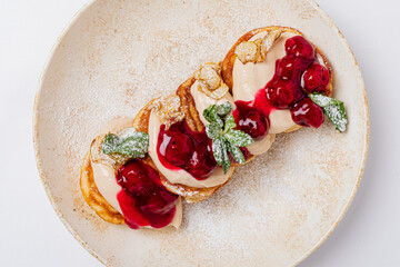pancakes with cherries and cream
