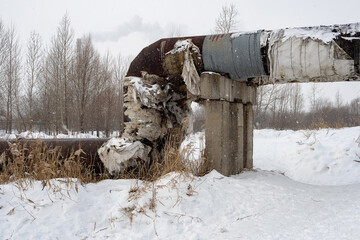 Overground heat pipes. Pipeline above the earth conducting heat for heating city. A snowy winter day