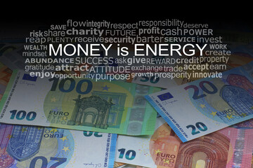 Fototapeta premium Money is Energy Euros Word Cloud concept - different denomination notes laid flat with a word cloud relevant to the good money does above 