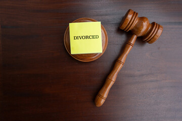 Judge’s Gavel with “Divorced” Note on Desk