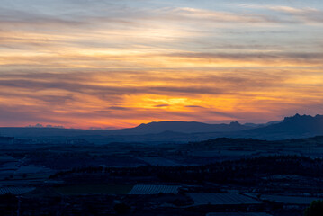 Colorful sunset over the vineyards of Rioja Alavesa in summer