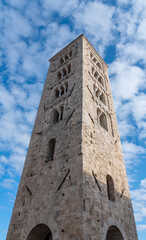 Vertical shoot of the Romanesque bell tower of Anagni Cathedral with beautiful mullioned and three-light windows.For safety reasons it was built near the church but separate from it