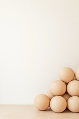Minimalist arrangement of wooden spheres creating harmonious bal