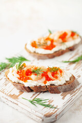 Toast skagen - shrimps and red caviar on bread. Classic swedish sandwich.