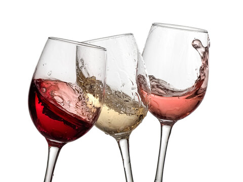 Three red, white and rose wine glasses plash on white background, studio shot