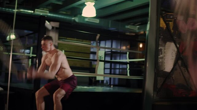 Man Performs Battle Rope Exercise in Gym