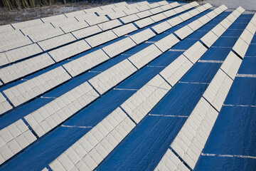 Snow-Covered Solar Farm Facing Winter Energy Challenges