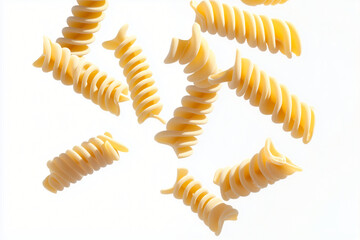 Naklejka premium Pasta Swirls: A collection of uncooked fusilli pasta swirls gracefully cascade, inviting culinary inspiration, and an appreciation for simplicity.