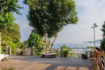 Obraz premium A serene viewpoint at Khao Hua Jook Pagoda in Koh Samui, Thailand, overlooking the coastline and distant islands