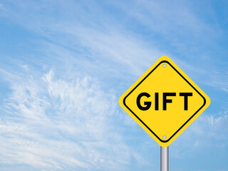 Yellow transportation sign with word gift on blue color sky background
